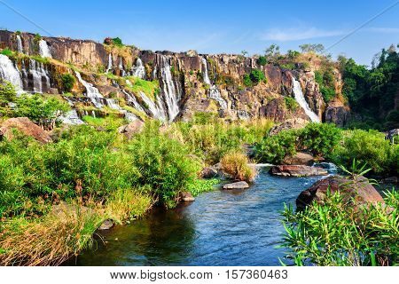 Scenic View Of Natural Cascading Waterfall With Crystal Clear Wa