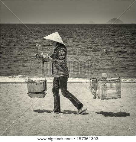 Vietnamese woman on a beach. Vietnam, Nha-Trang, May 2016.