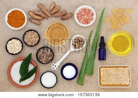 Skincare ingredients to soothe psoriasis on natural hemp paper background.