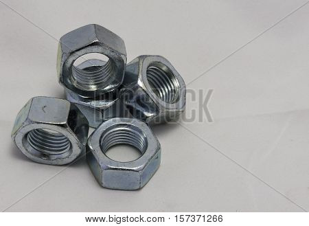 Some bolts and nuts on white background