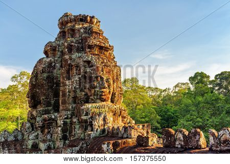 Enigmatic Giant Stone Faces Of Bayon Temple In Evening Sun