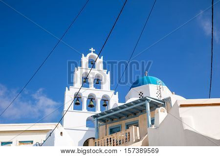 Greece Santorini island Pyrgos traditional architectures of the village with Orthodox church