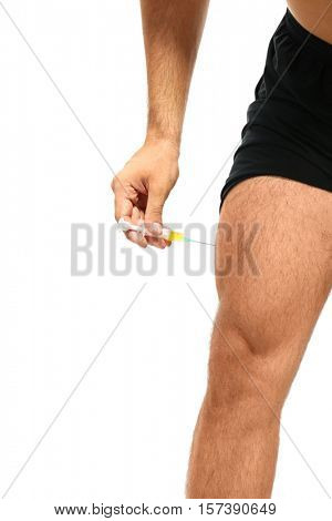 Muscular man injecting steroids, closeup