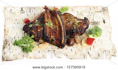 Grilled pork ribs with mushrooms and herbs