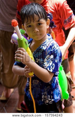 Bangkok, Thailand - April 13, 2008 : 
Children play with water guns during Songkran, the Thai New Year's festival.