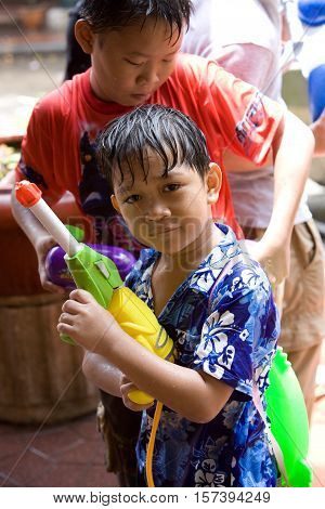 Bangkok, Thailand - April 13, 2008 : 
Children play with water guns during Songkran, the Thai New Year's festival.