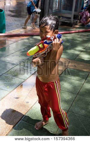 Bangkok, Thailand - April 13, 2008 : 
Children play with water guns during Songkran, the Thai New Year's festival.