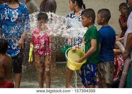 Bangkok, Thailand - April 13, 2008 : 
Children play with water guns during Songkran, the Thai New Year's festival.