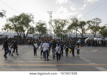 BANGKOK THAILAND - OCT 23 : A crowd of mourners on Ratchadamnoen Nai road in Sanam Luang area while the funeral of king Bhumibol Adulyadej in Grand Palace on october 23 2016