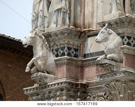 Architectural details of Duomo facade - SienaTuscanyItaly. The Duomo of Siena which was built in the 12th and 13th centuries is one of the prettiest churches in Gothic style in Italy