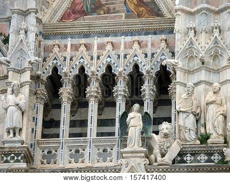 Architectural details of Duomo facade - SienaTuscanyItaly. The Duomo of Siena which was built in the 12th and 13th centuries is one of the prettiest churches in Gothic style in Italy