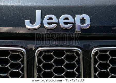 TURIN, ITALY - JUNE 9, 2016: Jeep logo on the front of a Cherokee model
