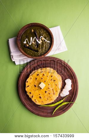 corn flour flat bread or roti or Makki Ki Roti with sarso da Saag or mustard leaves curry, Indian Food popular in winter season in north india