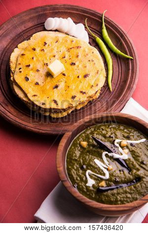 corn flour flat bread or roti or Makki Ki Roti with sarso da Saag or mustard leaves curry, Indian Food popular in winter season in north india