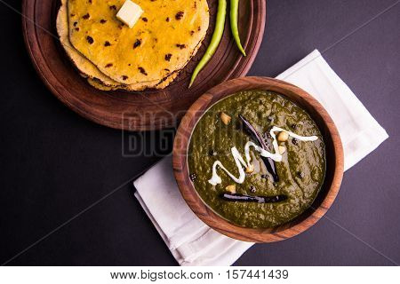 corn flour flat bread or roti or Makki Ki Roti with sarso da Saag or mustard leaves curry, Indian Food popular in winter season in north india