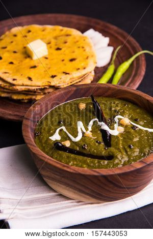 corn flour flat bread or roti or Makki Ki Roti with sarso da Saag or mustard leaves curry, Indian Food popular in winter season in north india