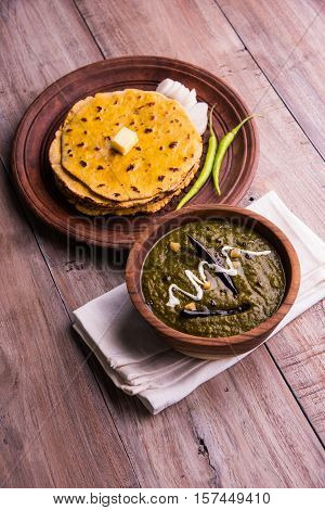 corn flour flat bread or roti or Makki Ki Roti with sarso da Saag or mustard leaves curry, Indian Food popular in winter season in north india