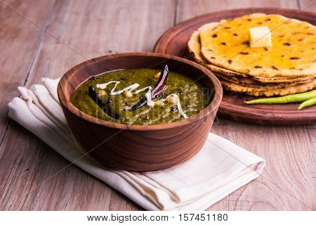 corn flour flat bread or roti or Makki Ki Roti with sarso da Saag or mustard leaves curry, Indian Food popular in winter season in north india