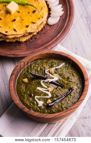 corn flour flat bread or roti or Makki Ki Roti with sarso da Saag or mustard leaves curry, Indian Food popular in winter season in north india