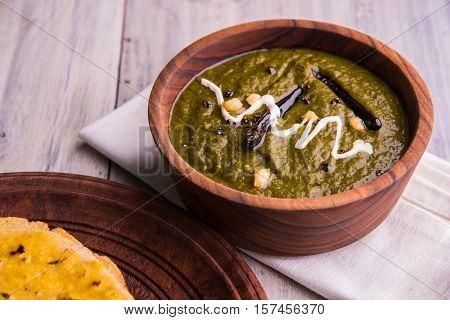 corn flour flat bread or roti or Makki Ki Roti with sarso da Saag or mustard leaves curry, Indian Food popular in winter season in north india