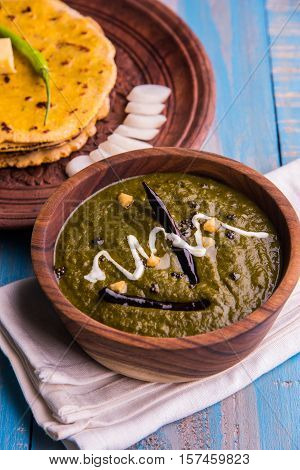corn flour flat bread or roti or Makki Ki Roti with sarso da Saag or mustard leaves curry, Indian Food popular in winter season in north india