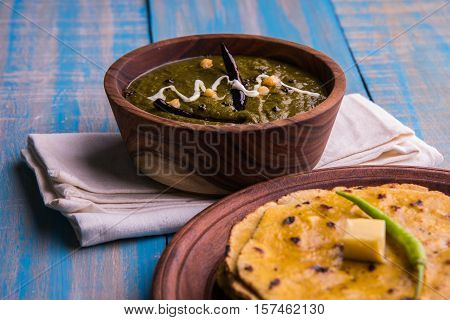 corn flour flat bread or roti or Makki Ki Roti with sarso da Saag or mustard leaves curry, Indian Food popular in winter season in north india