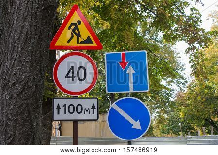 street traffic signs on a background of green foliage