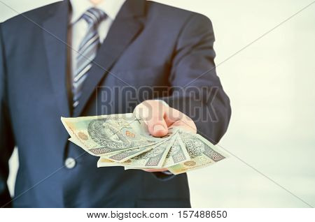 Range Of Polish Banknotes In Businessman Hand