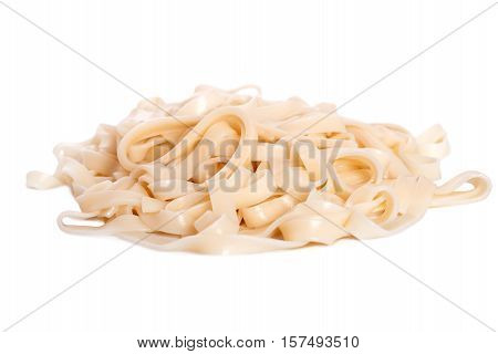 bioled udon noodles over a white background