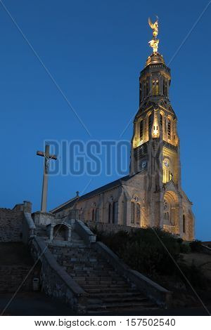 Church of Saint Michael in Saint-Michel-Mont-Mercure France with a large figure of the Archangel Michael at the top of the tower