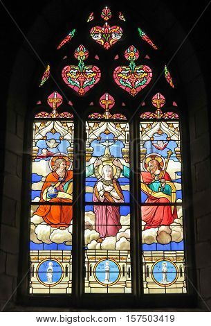Iffendic France - September 9 2016: Stained glass window in the Church of Saint Eloi in Iffendic France. Place adoption by St Louis Marie de Montfort First Holy Communion.