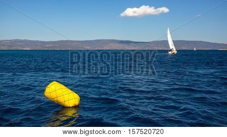 Finish line buoy at sailing sea yacht race regattas. Luxery vacations, adventure, travel.