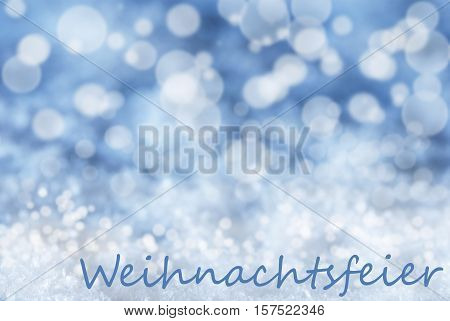 German Text Weihnachtsfeier Means Christmas Party. Blue Bokeh Christmas Background Or Texture With Snow. Copy Space For Your Text Here