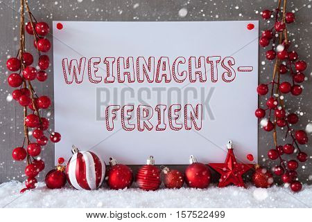 Label With German Text Weihnachtsferien Means Christmas Break. Red Christmas Decoration Like Balls On Snow. Urban And Modern Cement Wall As Background With Snowflakes.