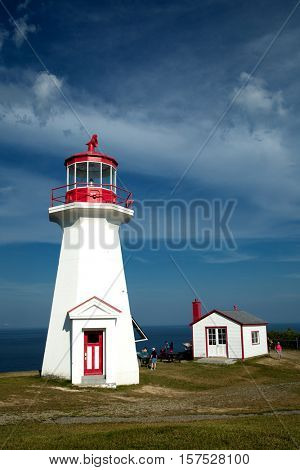 The red and white Cap Gaspe lighthouse in Gaspesie, Quebec, Canada during summer season