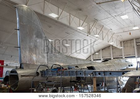 DAYTON, OHIO, USA-NOVEMBER 18, 2016: National Museum USAF is restoring the famous original WWII Memphis Belle B-17F Flying Fortress bomber, shown here with tail stabilizer & wing in restoration area.