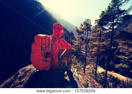 young woman backpacker enjoy the sunrise at the himalaya mountains