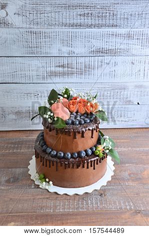 chocolate two layered wedding cake with roses