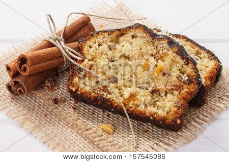 Fresh Baked Fruitcake With Ingredients On Boards