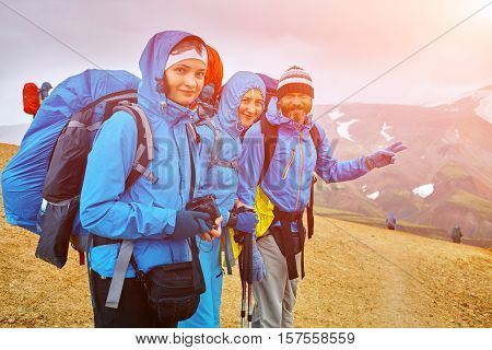 hikers on the trail in the Islandic mountains. Trek in National Park Landmannalaugar, Iceland