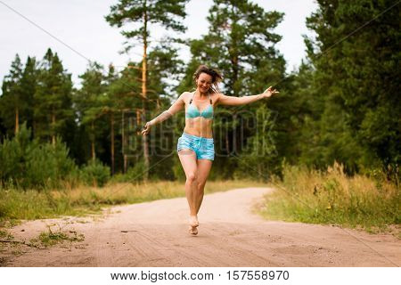 Girl In Bathing Suit In The Forest