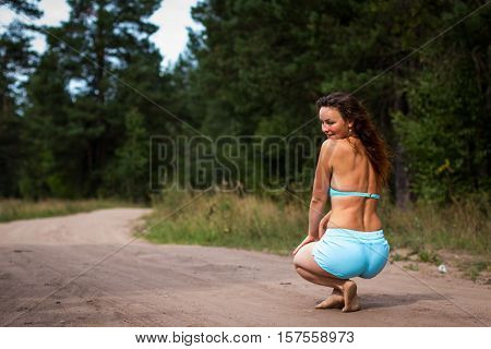 Girl In Bathing Suit In The Forest
