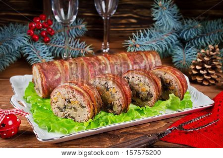 Oven Baked meatloaf with bacon mushrooms carrots onions and mashed potatoes. Christmas appetizer
