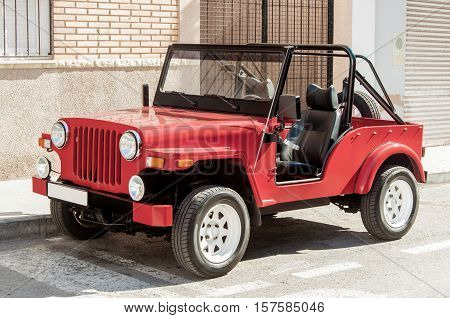 Old military american command car Willys on the road