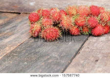 rambutan sweet fruit fresh on wood background : Select focus with shallow depth of field.