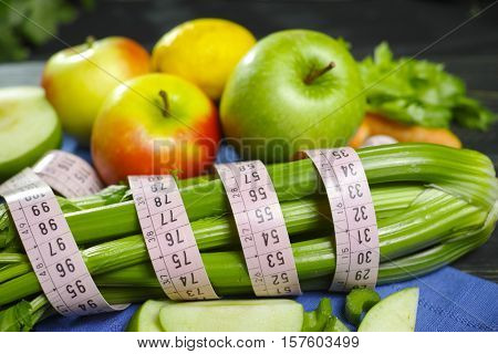 Green vegetables and fruits - celery shoots and apples healthy fitness diet concept