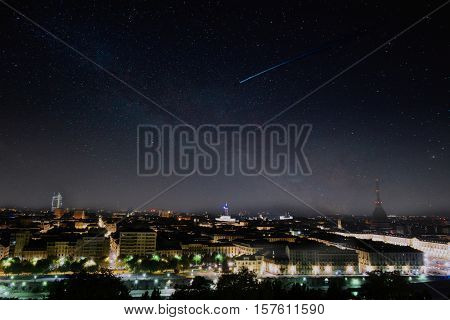 skyscraper turin with shooting star night light