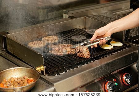 Real kitchen of bar and grill restaurant in operation