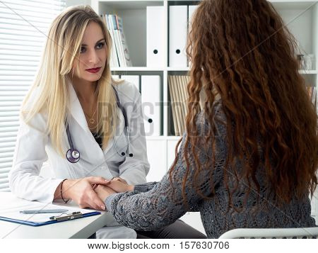 Friendly Female Doctor Hands Holding Her Patient Hands