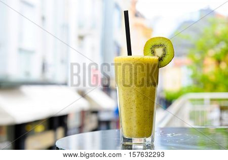 Glass of Kiwi smoothie on the terrace